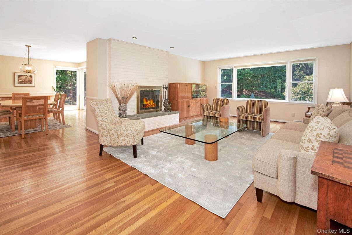 Dining room, Fireplace, Interior, Living room, Pendant Lights, Recessed Lighting, Wood Texture Flooring