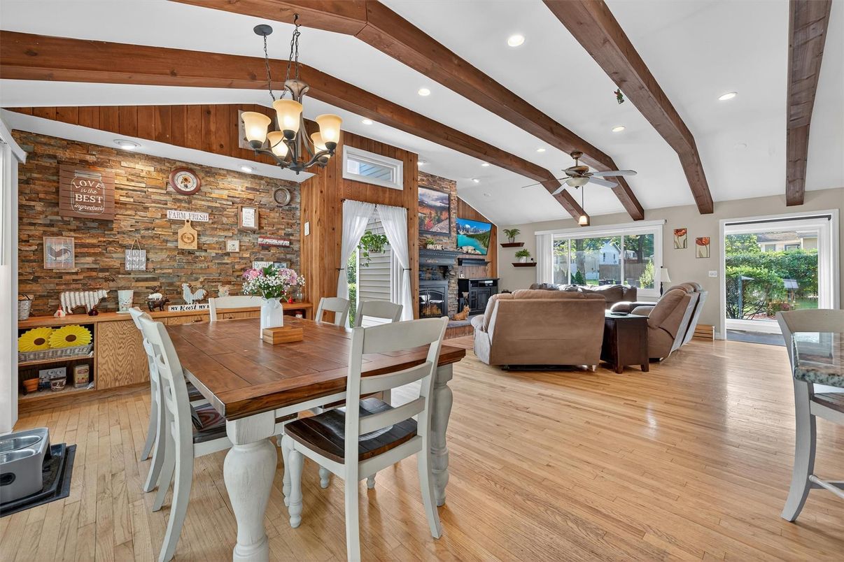 Chandelier, Dining room, Fireplace, Interior, Living room, Recessed Lighting, Stone Walls, Wooden Beams, Wood Texture Flooring, Wooden Walls