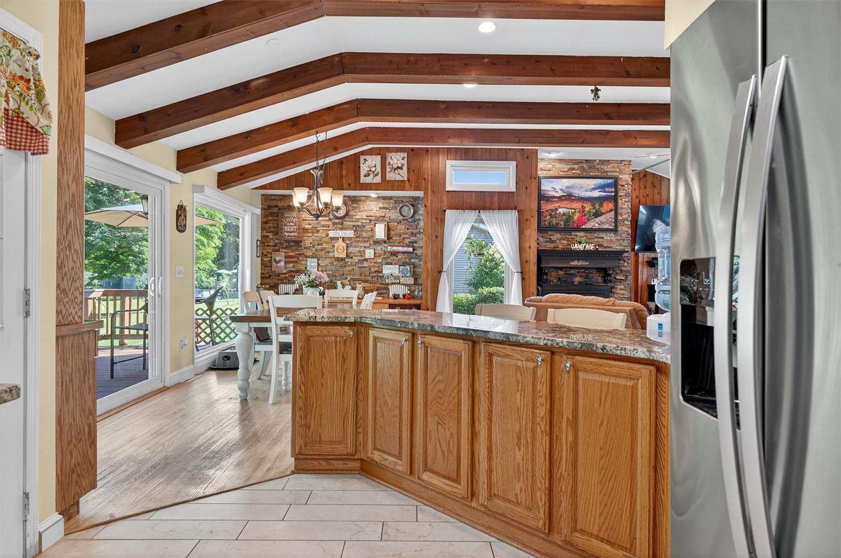 Chandelier, Dining room, Fireplace, Interior, Kitchen, Recessed Lighting, Stone Walls, Wooden Beams, Wood Texture Flooring