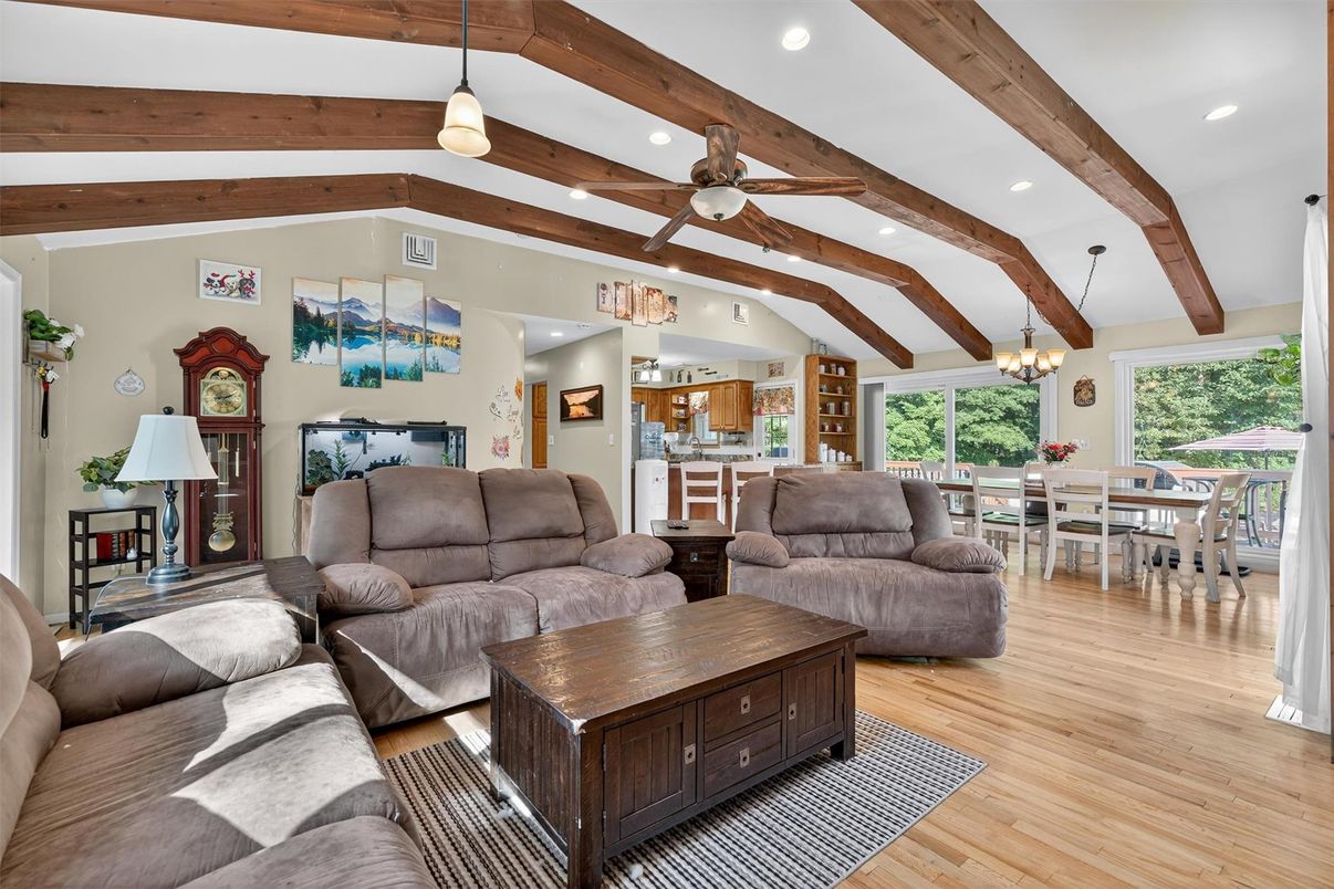 Chandelier, Dining room, Interior, Living room, Pendant Lights, Recessed Lighting, Wooden Beams, Wood Texture Flooring