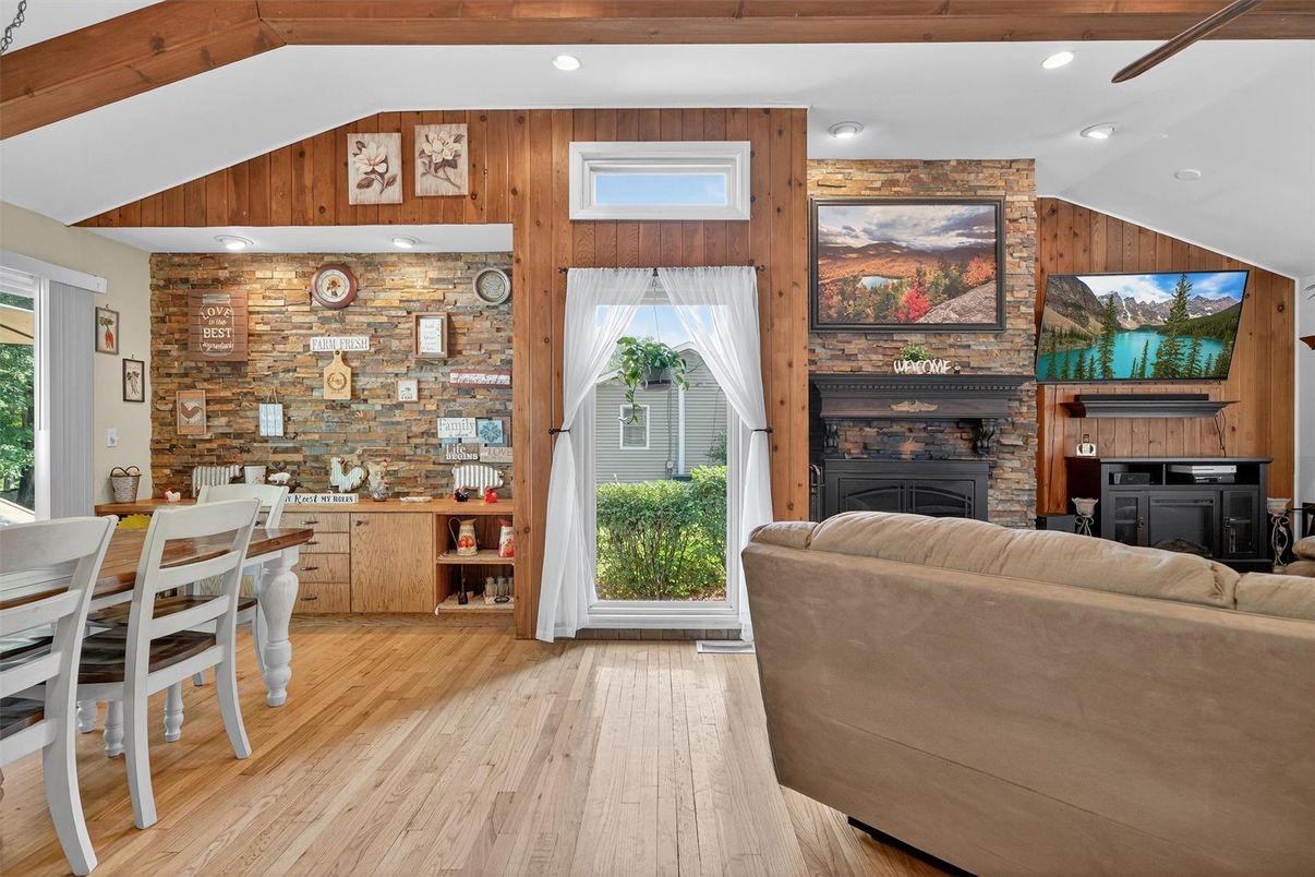 Dining room, Fireplace, Interior, Living room, Recessed Lighting, Stone Walls, Wooden Beams, Wood Texture Flooring, Wooden Walls