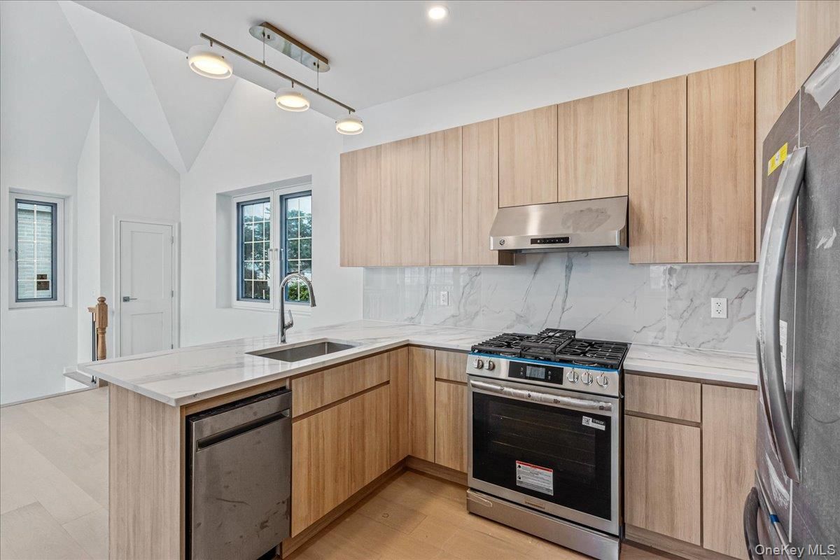 Interior, Kitchen, Marble Walls, Recessed Lighting, Stainless Steel Appliances, Wood Texture Flooring