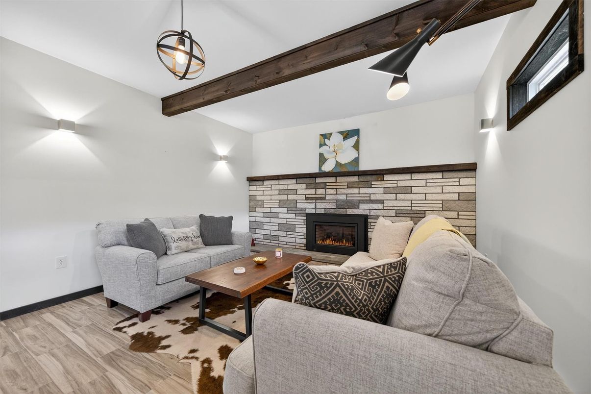 Fireplace, Interior, Living room, Pendant Lights, Stone Walls, Wooden Beams, Wood Texture Flooring