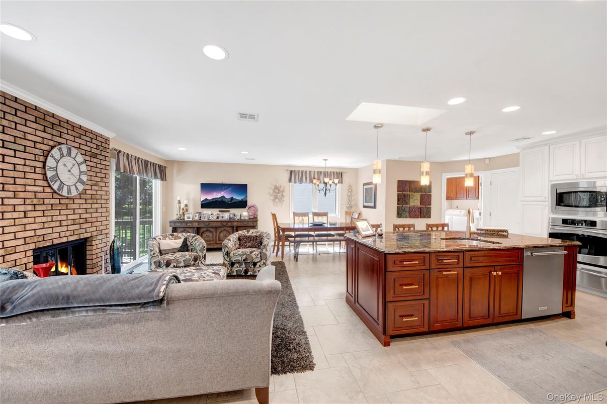 Dining room, Fireplace, Interior, Kitchen, Living room, Pendant Lights, Recessed Lighting, Stainless Steel Appliances, Stone Walls