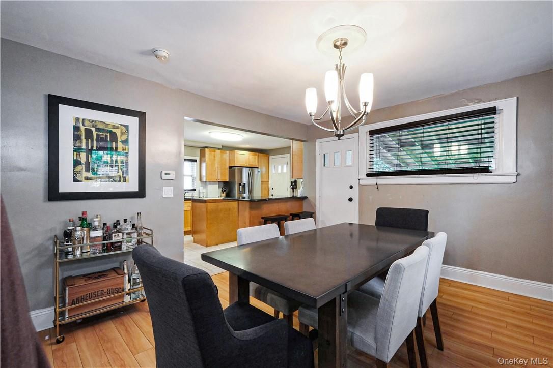 Chandelier, Dining room, Interior, Kitchen, Stainless Steel Appliances, Wood Texture Flooring