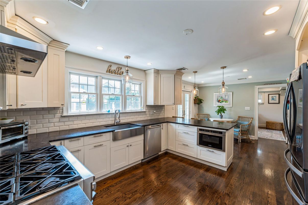 Dining room, Interior, Kitchen, Pendant Lights, Recessed Lighting, Stainless Steel Appliances, Wood Texture Flooring