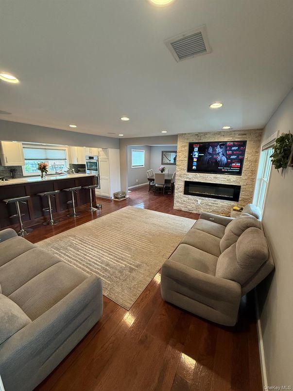 Dining room, Fireplace, Interior, Kitchen, Living room, Recessed Lighting, Wood Texture Flooring