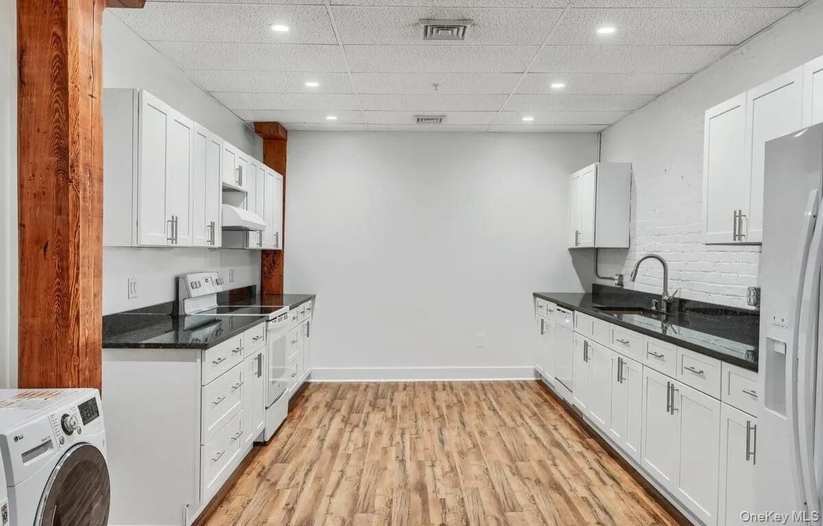 Interior, Kitchen, Recessed Lighting, Washer, Wood Texture Flooring