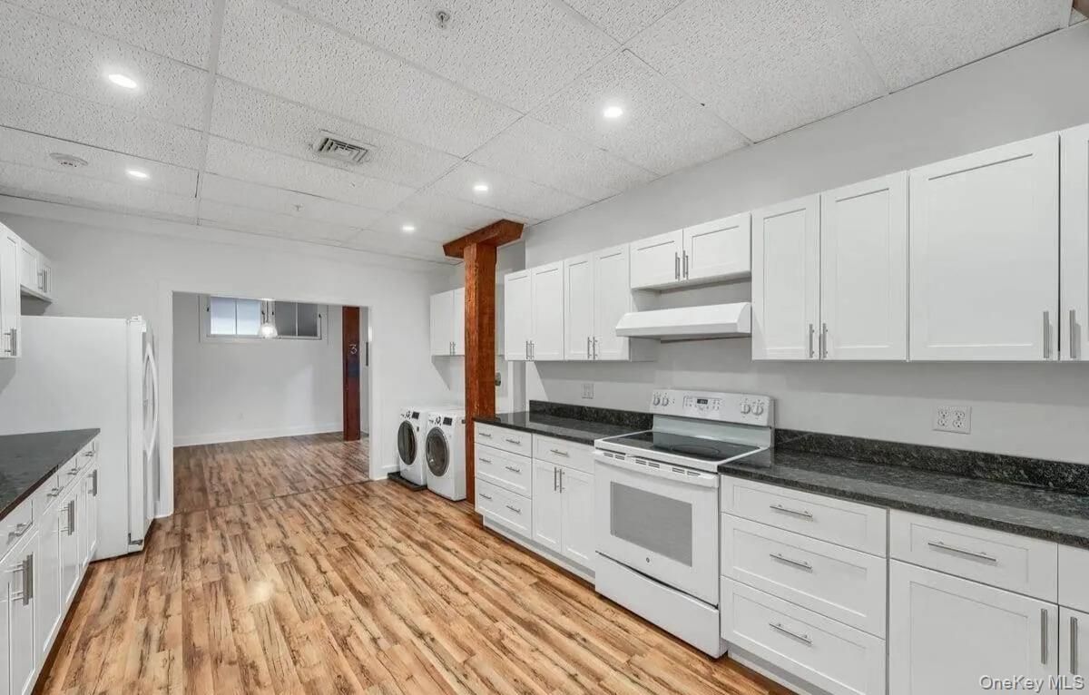 Interior, Kitchen, Recessed Lighting, Washer, Wood Texture Flooring