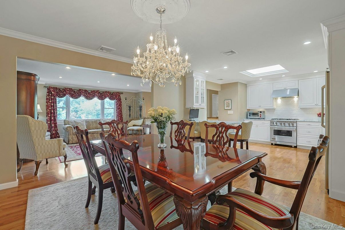 Chandelier, Dining room, Interior, Kitchen, Living room, Recessed Lighting, Stainless Steel Appliances, Wood Texture Flooring