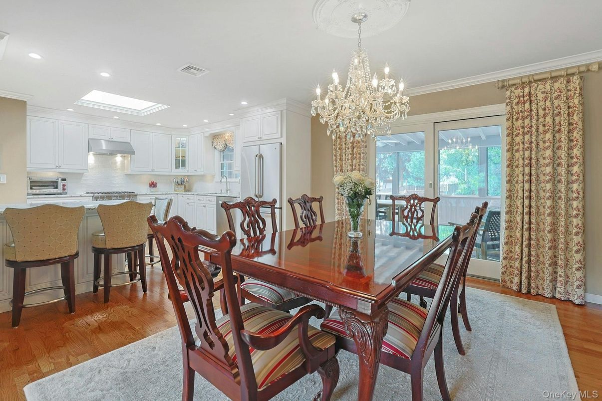 Chandelier, Dining room, Interior, Kitchen, Recessed Lighting, Stainless Steel Appliances, Wood Texture Flooring