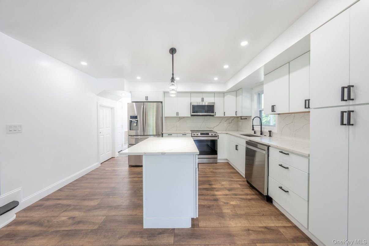 Interior, Kitchen, Marble Walls, Pendant Lights, Recessed Lighting, Stainless Steel Appliances, Wood Texture Flooring