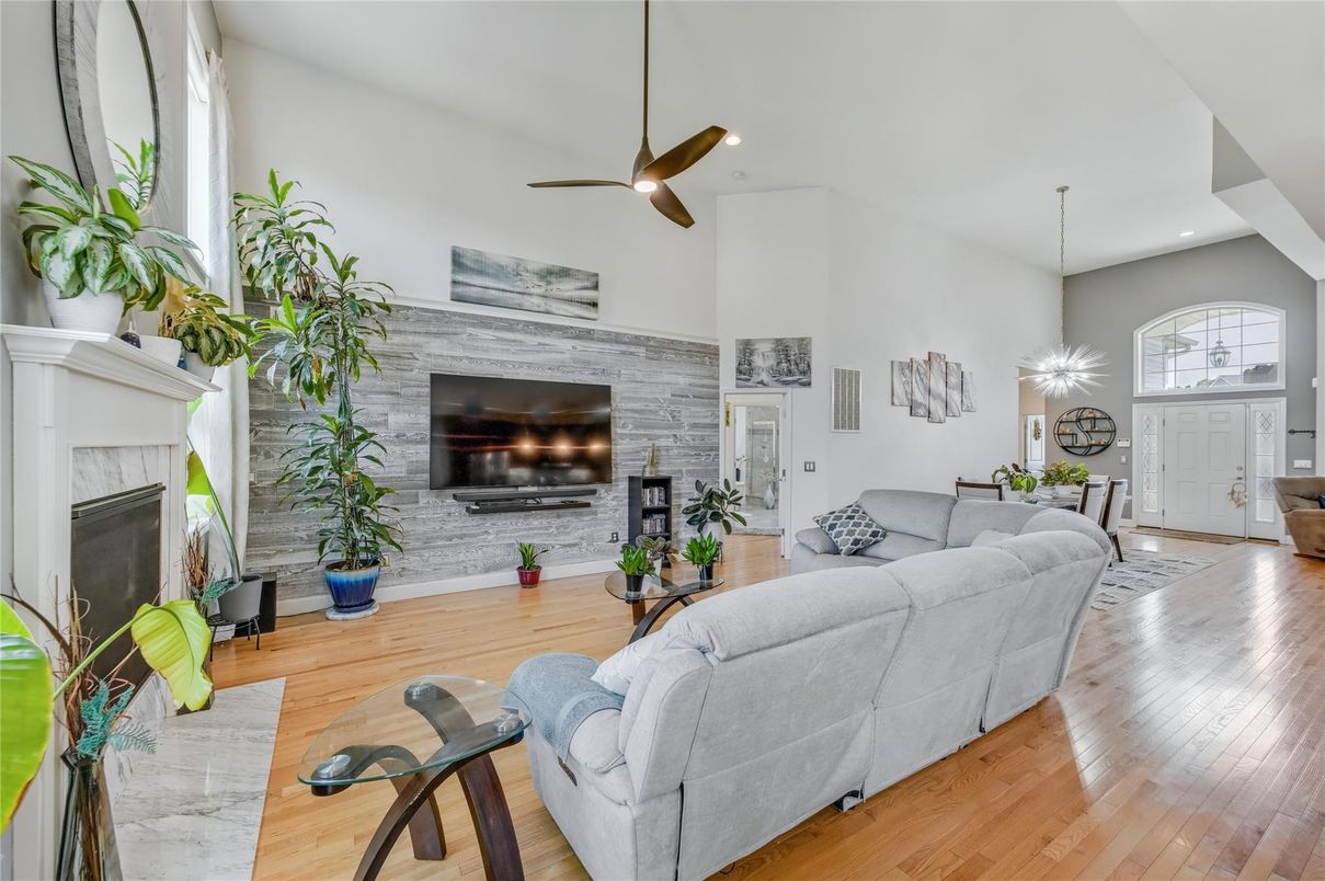 Fireplace, Interior, Living room, Recessed Lighting, Stone Walls, Wood Texture Flooring