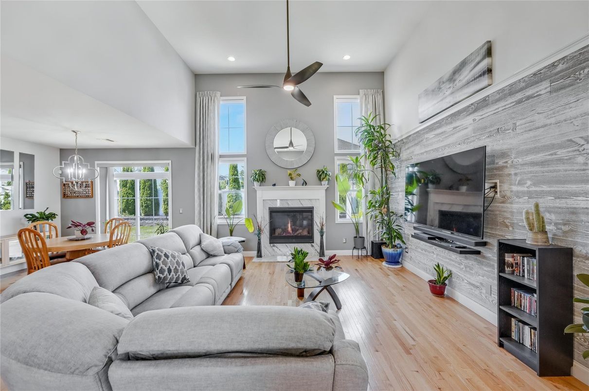 Dining room, Fireplace, Interior, Living room, Pendant Lights, Recessed Lighting, Wood Texture Flooring