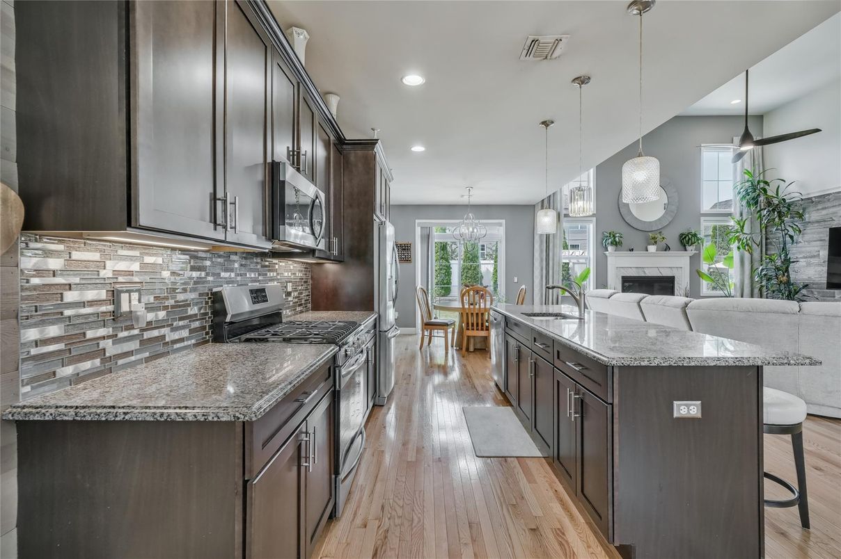 Dining room, Fireplace, Interior, Kitchen, Pendant Lights, Recessed Lighting, Wood Texture Flooring