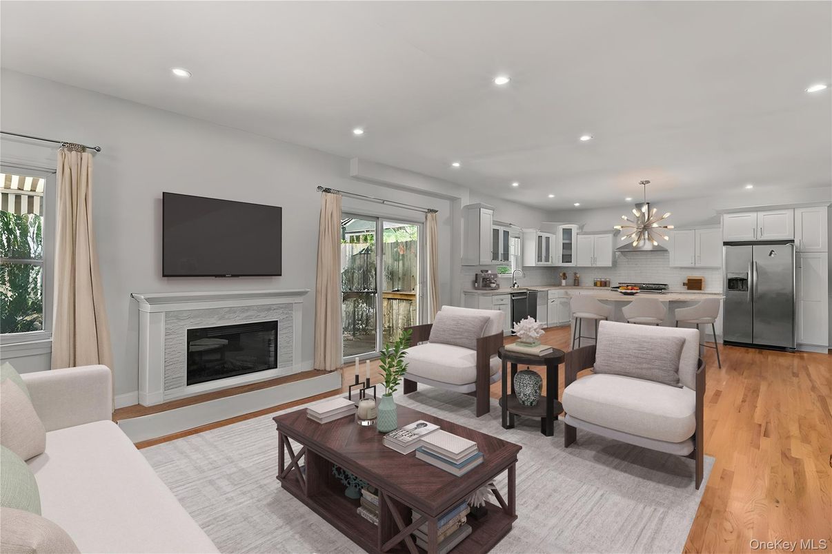 Fireplace, Interior, Kitchen, Living room, Pendant Lights, Recessed Lighting, Stainless Steel Appliances, Wood Texture Flooring