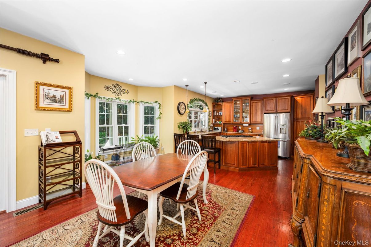 Dining room, Interior, Kitchen, Pendant Lights, Recessed Lighting, Stainless Steel Appliances, Wood Texture Flooring