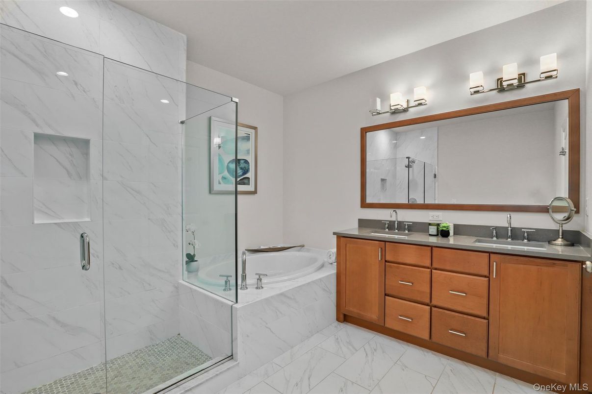 Bathroom, Dual Sink Vanities, Glass Shower, Interior, Marble, Marble Walls, Recessed Lighting