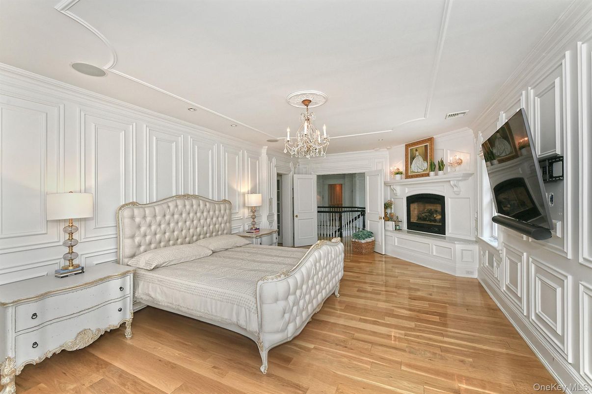 Bedroom, Chandelier, Fireplace, Interior, Recessed Lighting, Wood Texture Flooring