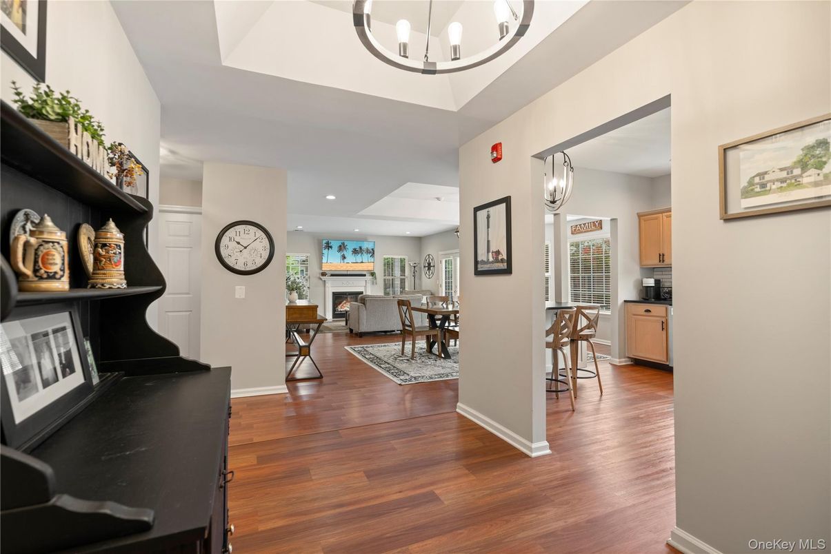 Dining room, Fireplace, Interior, Living room, Pendant Lights, Recessed Lighting, Wood Texture Flooring