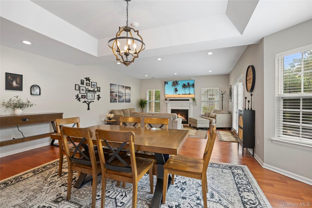 Chandelier, Dining room, Fireplace, Interior, Living room, Pendant Lights, Recessed Lighting, Wood Texture Flooring