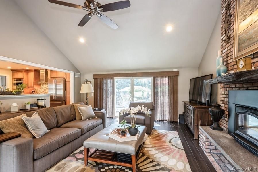 Fireplace, Interior, Kitchen, Living room, Recessed Lighting, Stainless Steel Appliances, Stone Walls, Wood Texture Flooring