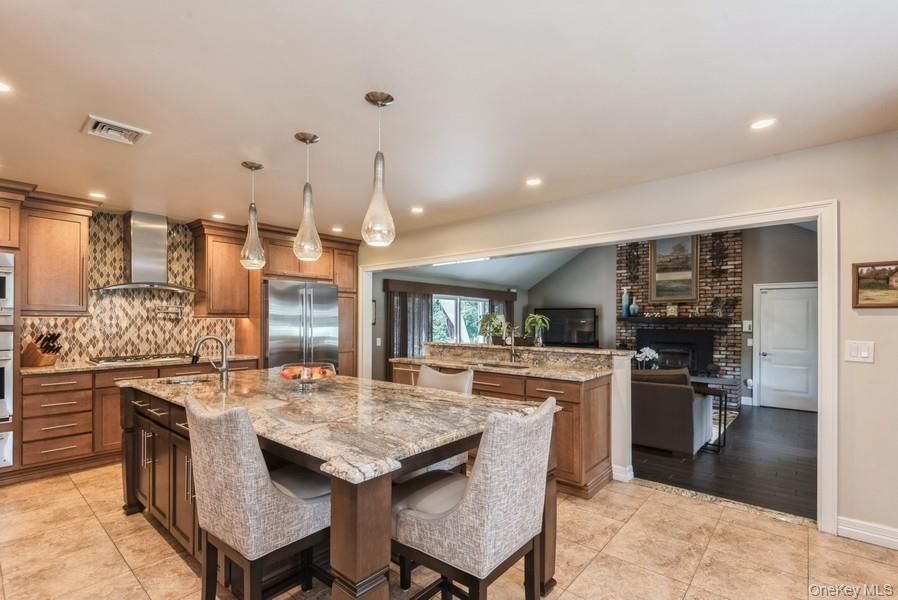 Dining room, Fireplace, Interior, Kitchen, Living room, Pendant Lights, Recessed Lighting, Stainless Steel Appliances, Stone Walls