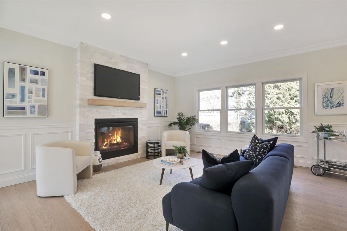 Fireplace, Interior, Living room, Recessed Lighting, Stone Walls, Wood Texture Flooring