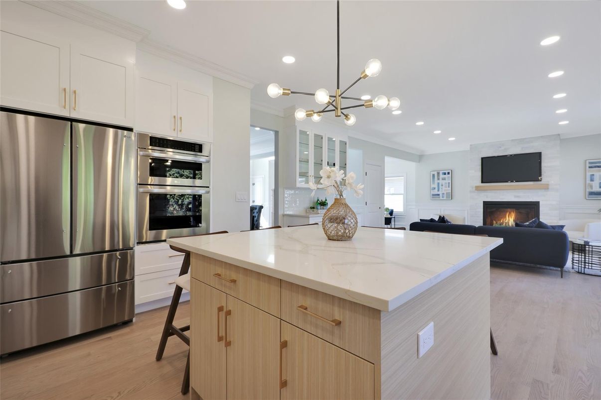 Fireplace, Interior, Kitchen, Living room, Pendant Lights, Recessed Lighting, Stainless Steel Appliances, Wood Texture Flooring