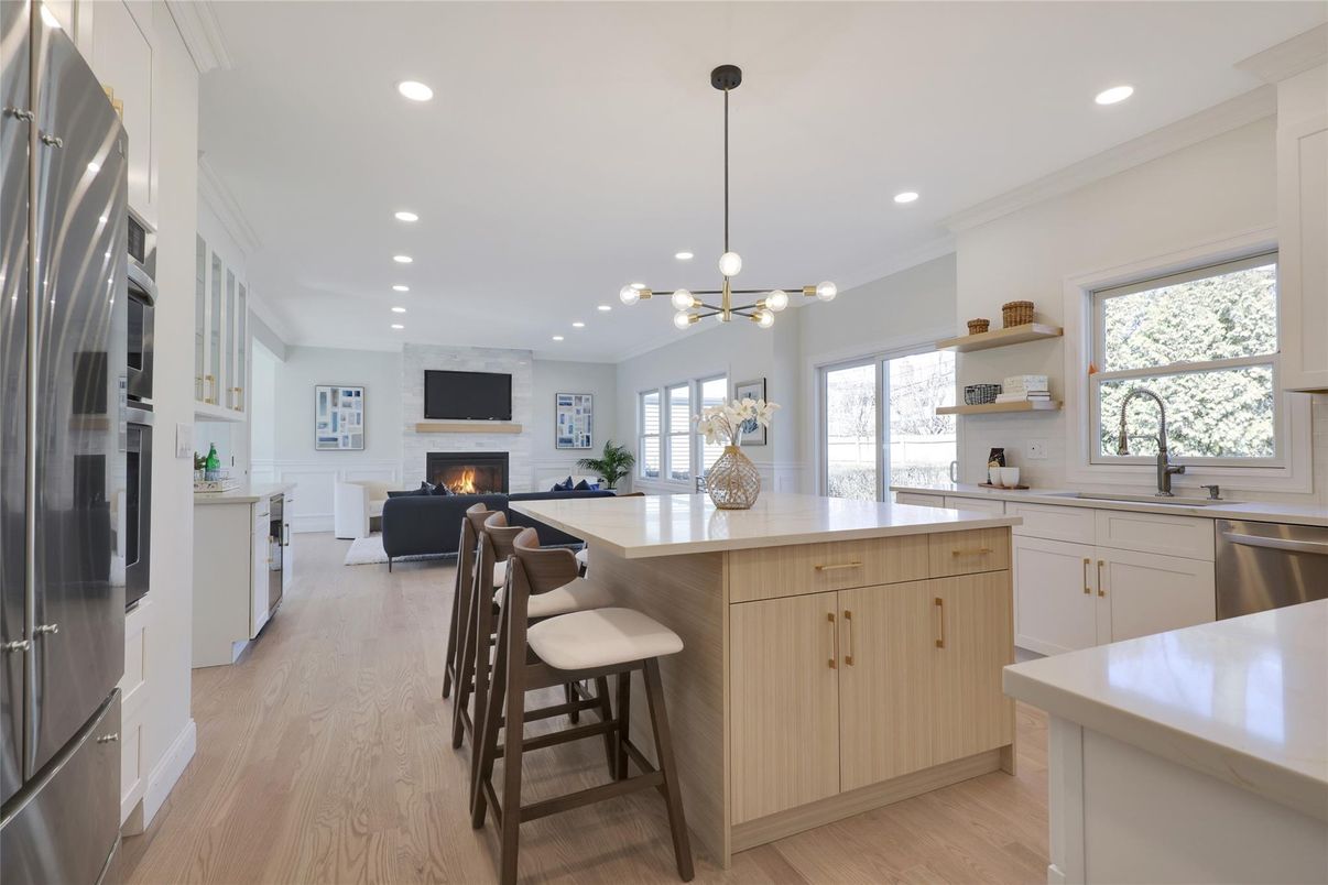 Fireplace, Interior, Kitchen, Living room, Pendant Lights, Recessed Lighting, Stainless Steel Appliances, Wood Texture Flooring