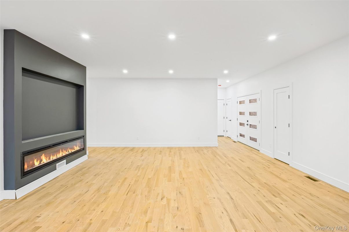 Empty room, Fireplace, Interior, Recessed Lighting, Wood Texture Flooring