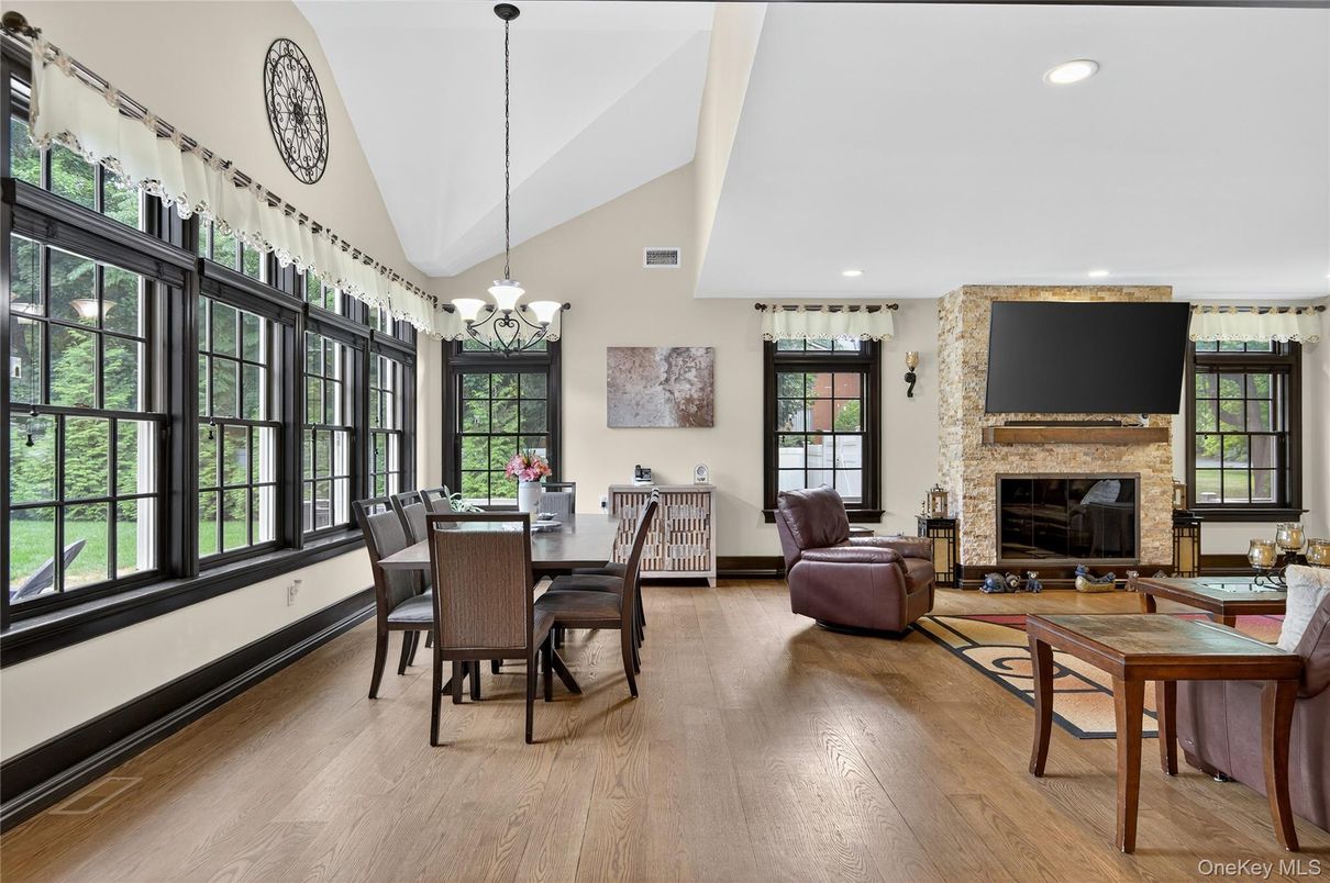 Chandelier, Dining room, Fireplace, Interior, Living room, Recessed Lighting, Stone Walls, Wood Texture Flooring