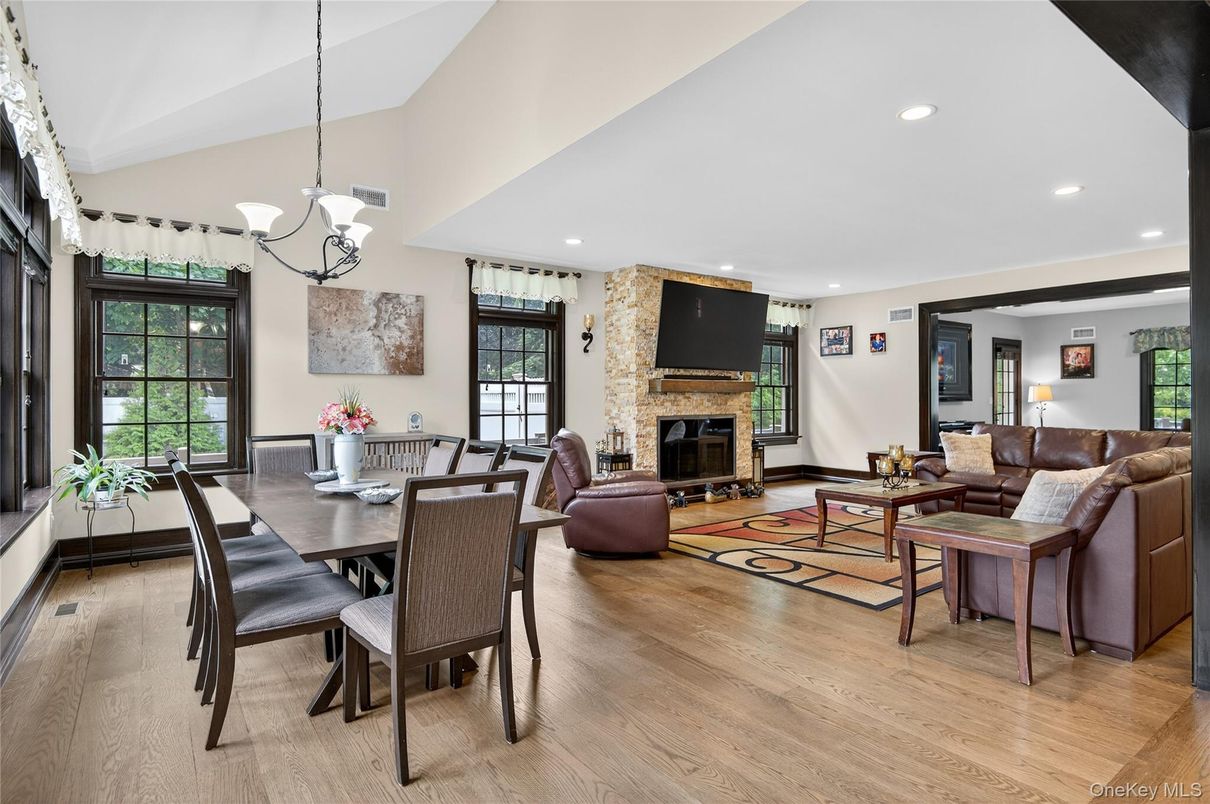 Dining room, Fireplace, Interior, Living room, Pendant Lights, Recessed Lighting, Wood Texture Flooring