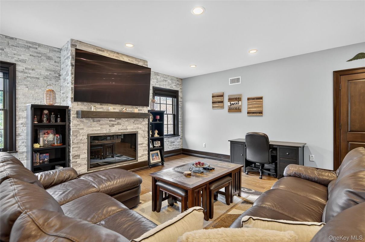 Fireplace, Interior, Living room, Recessed Lighting, Stone Walls, Wood Texture Flooring