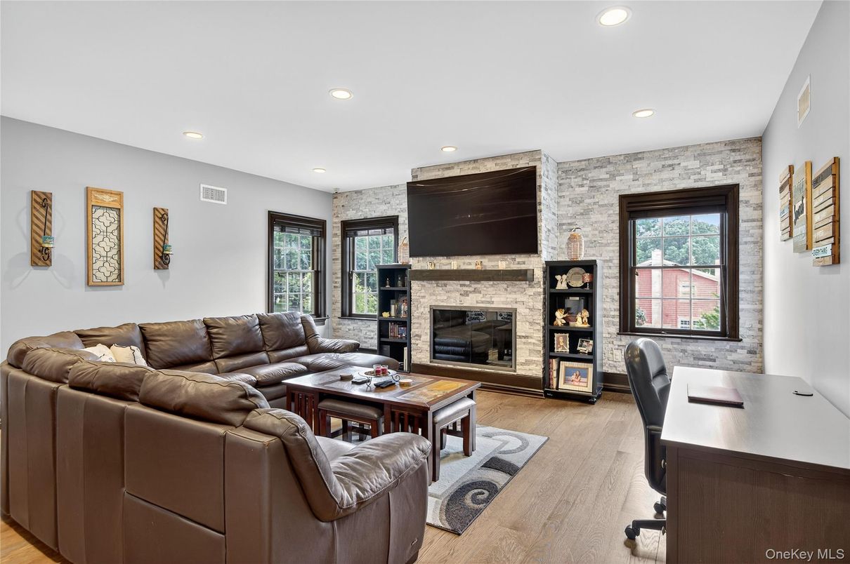 Fireplace, Interior, Living room, Recessed Lighting, Stone Walls, Wood Texture Flooring