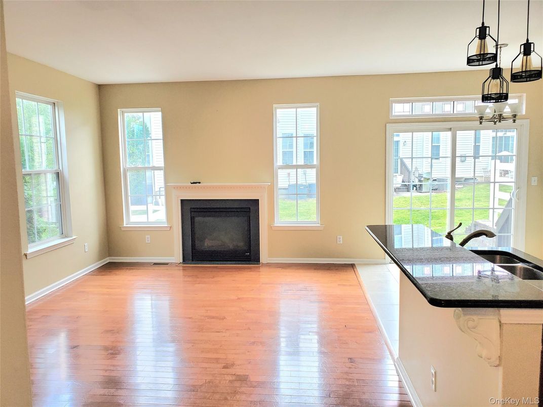 Empty room, Fireplace, Interior, Pendant Lights, Wood Texture Flooring