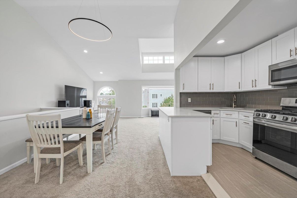 Dining room, Interior, Kitchen, Pendant Lights, Recessed Lighting, Stainless Steel Appliances, Wood Texture Flooring