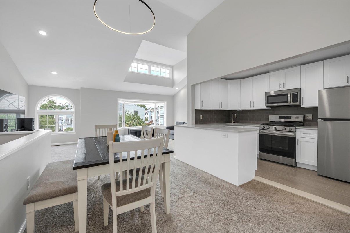 Dining room, Interior, Kitchen, Recessed Lighting, Stainless Steel Appliances, Wood Texture Flooring