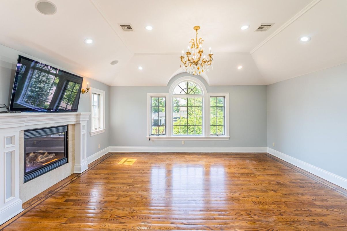 Chandelier, Empty room, Fireplace, Interior, Recessed Lighting, Wood Texture Flooring