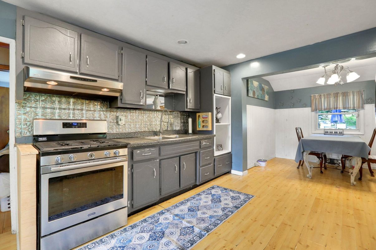 Chandelier, Dining room, Interior, Kitchen, Recessed Lighting, Stainless Steel Appliances, Wood Texture Flooring