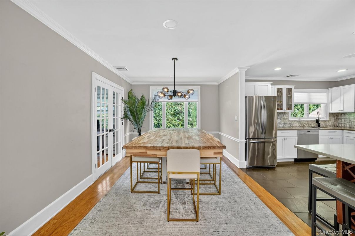 Dining room, Interior, Kitchen, Pendant Lights, Recessed Lighting, Stainless Steel Appliances, Wood Texture Flooring