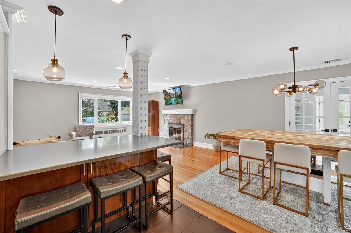 Dining room, Fireplace, Interior, Pendant Lights, Recessed Lighting, Wood Texture Flooring