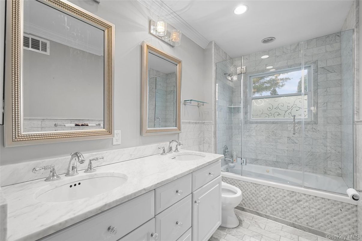 Bathroom, Dual Sink Vanities, Glass Shower, Interior, Marble, Marble Walls, Recessed Lighting