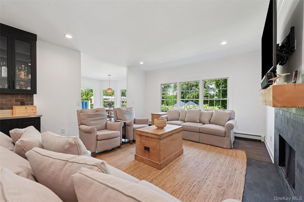 Dining room, Fireplace, Interior, Living room, Pendant Lights, Recessed Lighting, Wood Texture Flooring