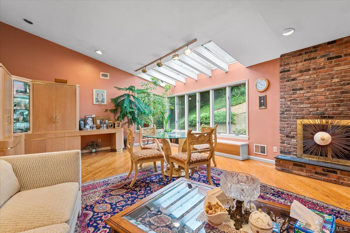 Dining room, Fireplace, Interior, Recessed Lighting, Stone Walls, Wood Texture Flooring