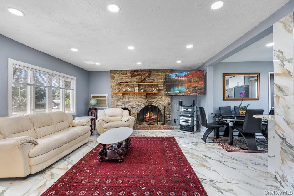 Dining room, Fireplace, Interior, Living room, Marble, Recessed Lighting, Stone Walls