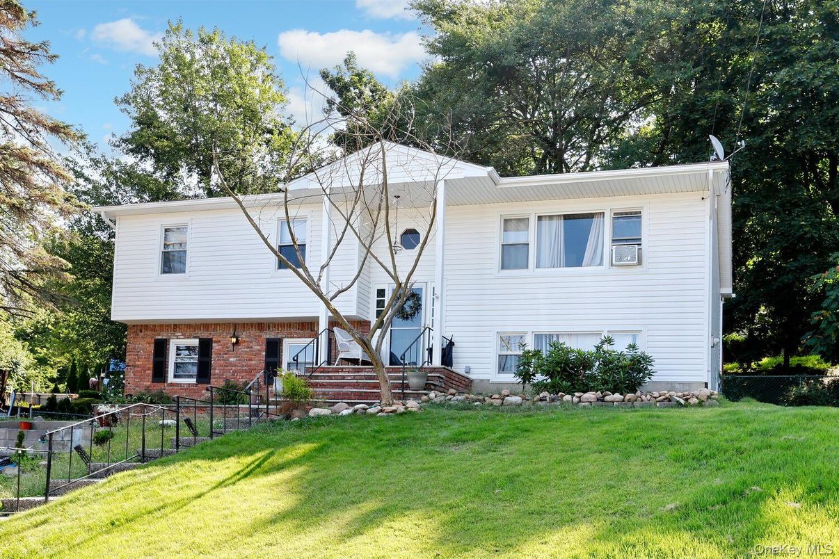 Backyard, Exterior, Facade, Brick Facade, Raised Ranch