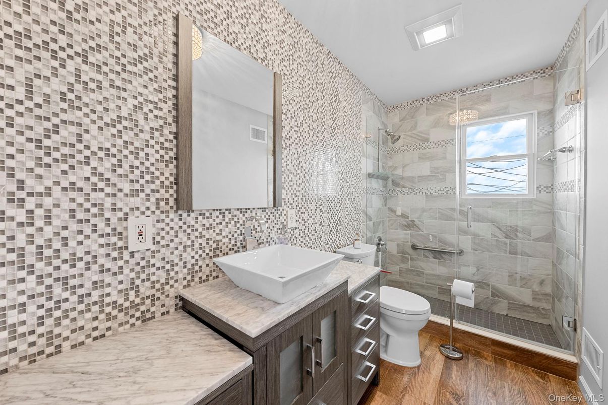 Bathroom, Glass Shower, Interior, Marble Walls, Wood Texture Flooring