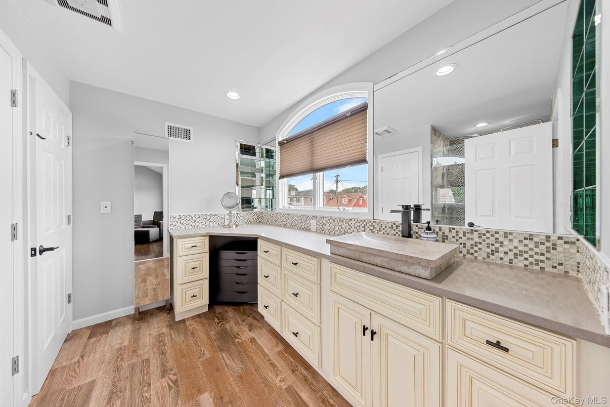 Bathroom, Dual Sink Vanities, Interior, Recessed Lighting, Wood Texture Flooring