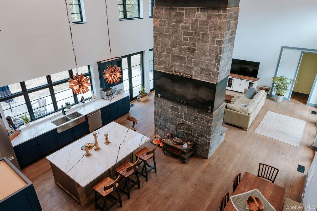 Dining room, Fireplace, Interior, Kitchen, Living room, Pendant Lights, Stone Walls, Wood Texture Flooring
